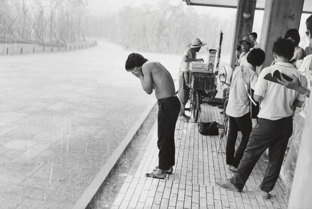 Young Man Washing His Face in the Rain at the "Anti-War Exposition", Held Near the Proposed Site for Expo '70, Osaka