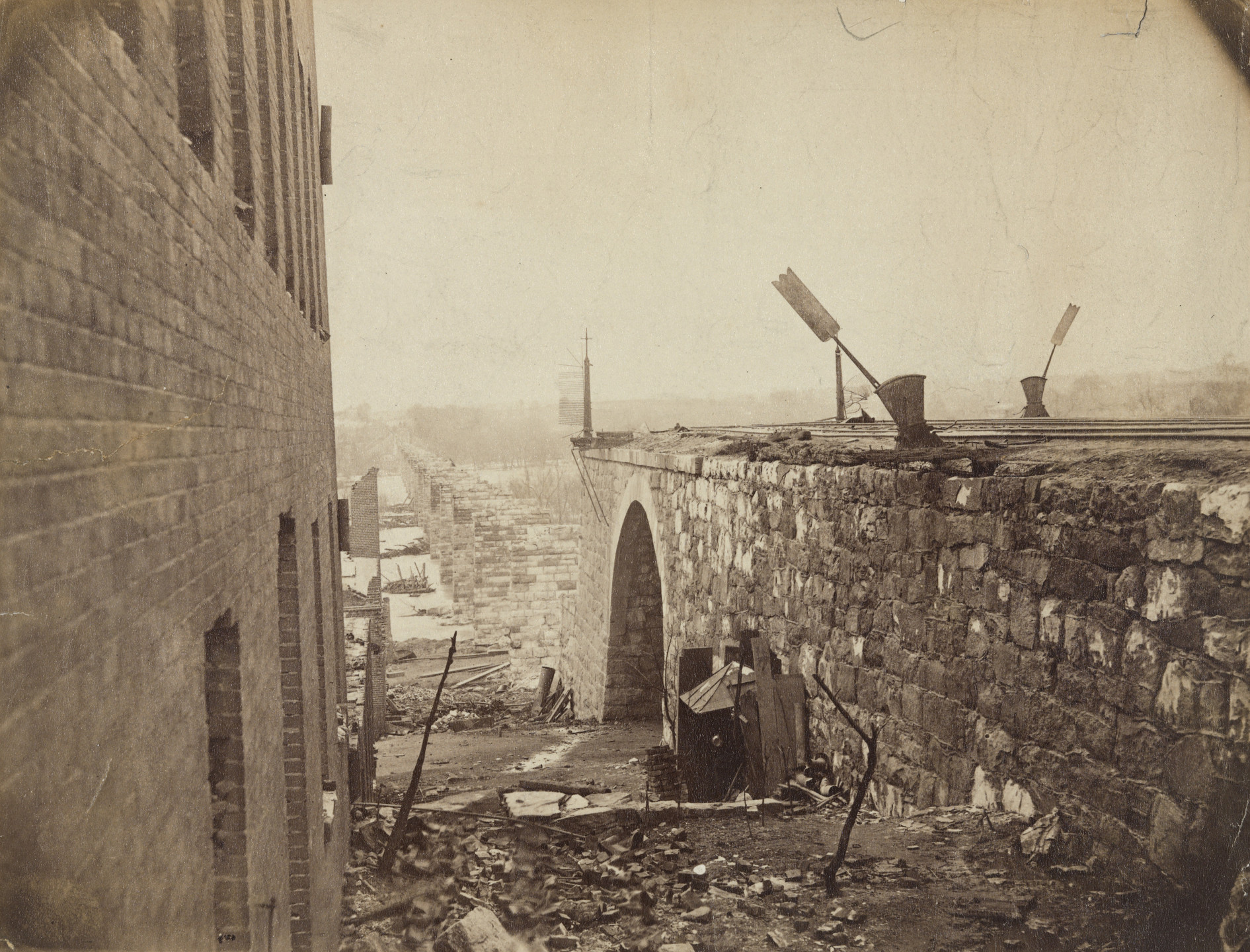 Mathew B. Brady (studio of). Ruins of Richmond &amp; Petersburg Railroad Bridge, Richmond, Virginia. April 1865
