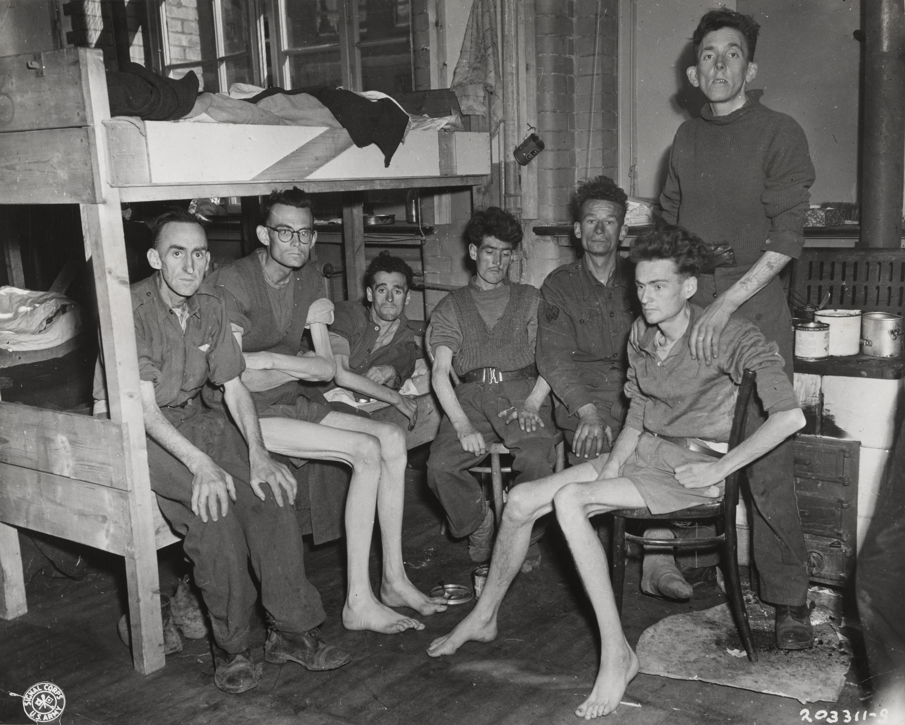 U.S. Army Signal Corps. "Three Emaciated British Tommies Held Prisoner by the Germans for Five Years". April 8, 1945