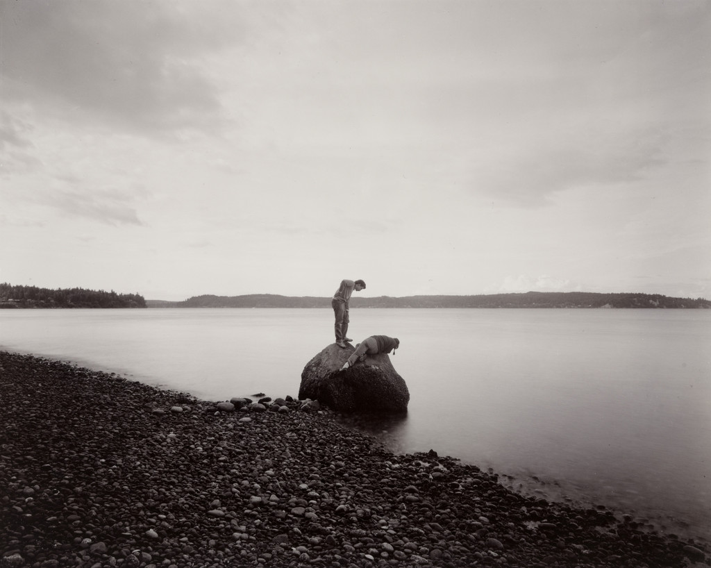 Thom and Susan Looking at Petroglyphs, Puget Sound, Washington