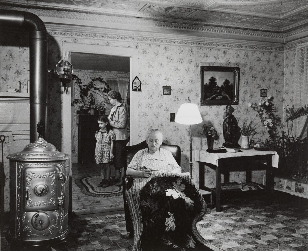 In the home of Steve Dino, Italian FSA client near Canterbury, Connecticut. His mother sells hooked rugs to suppliment their farm income