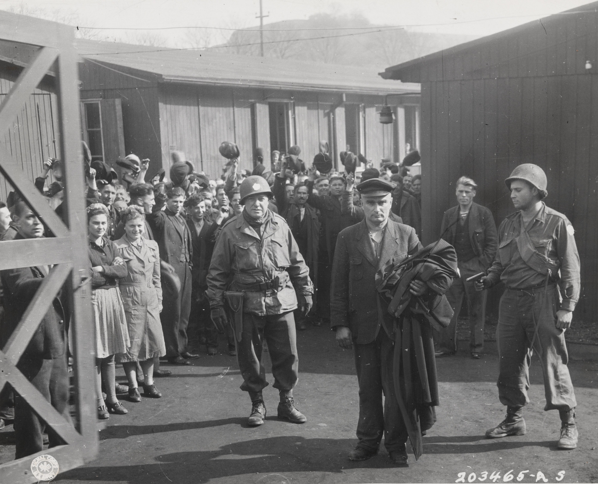 U.S. Army Signal Corps. "Major Anthony Malankowski and Private Arthur Fields Lead Away the Commandant of Altendorn Camp"