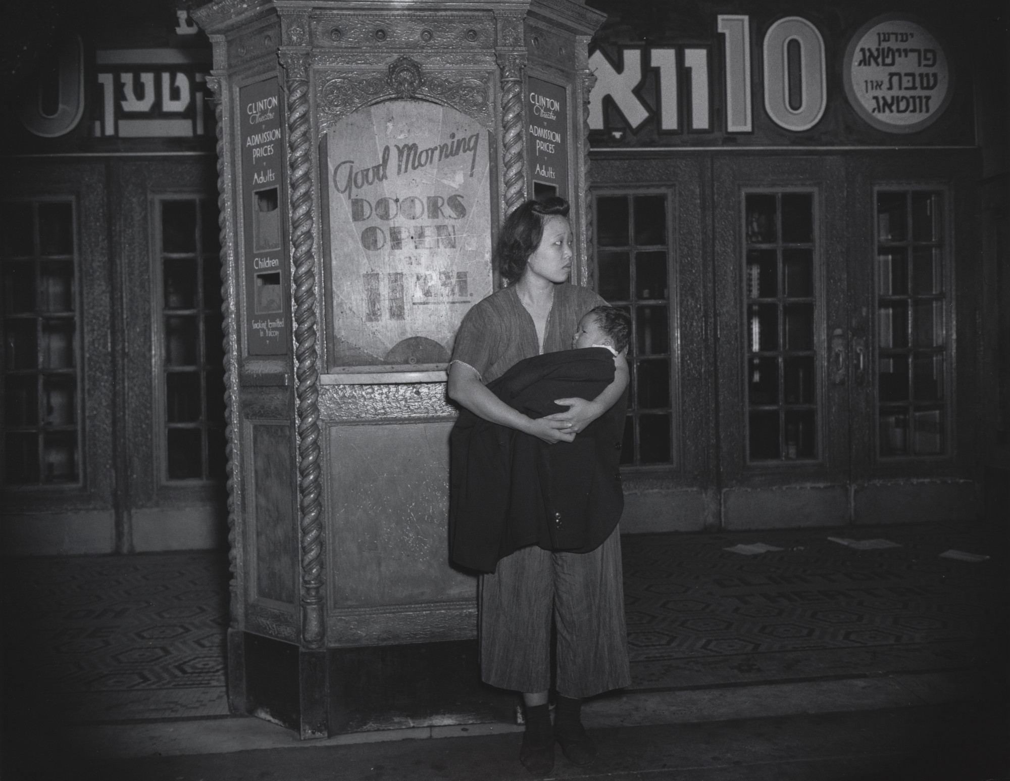 Weegee (Arthur Fellig). Refugees from a Tenement Fire
