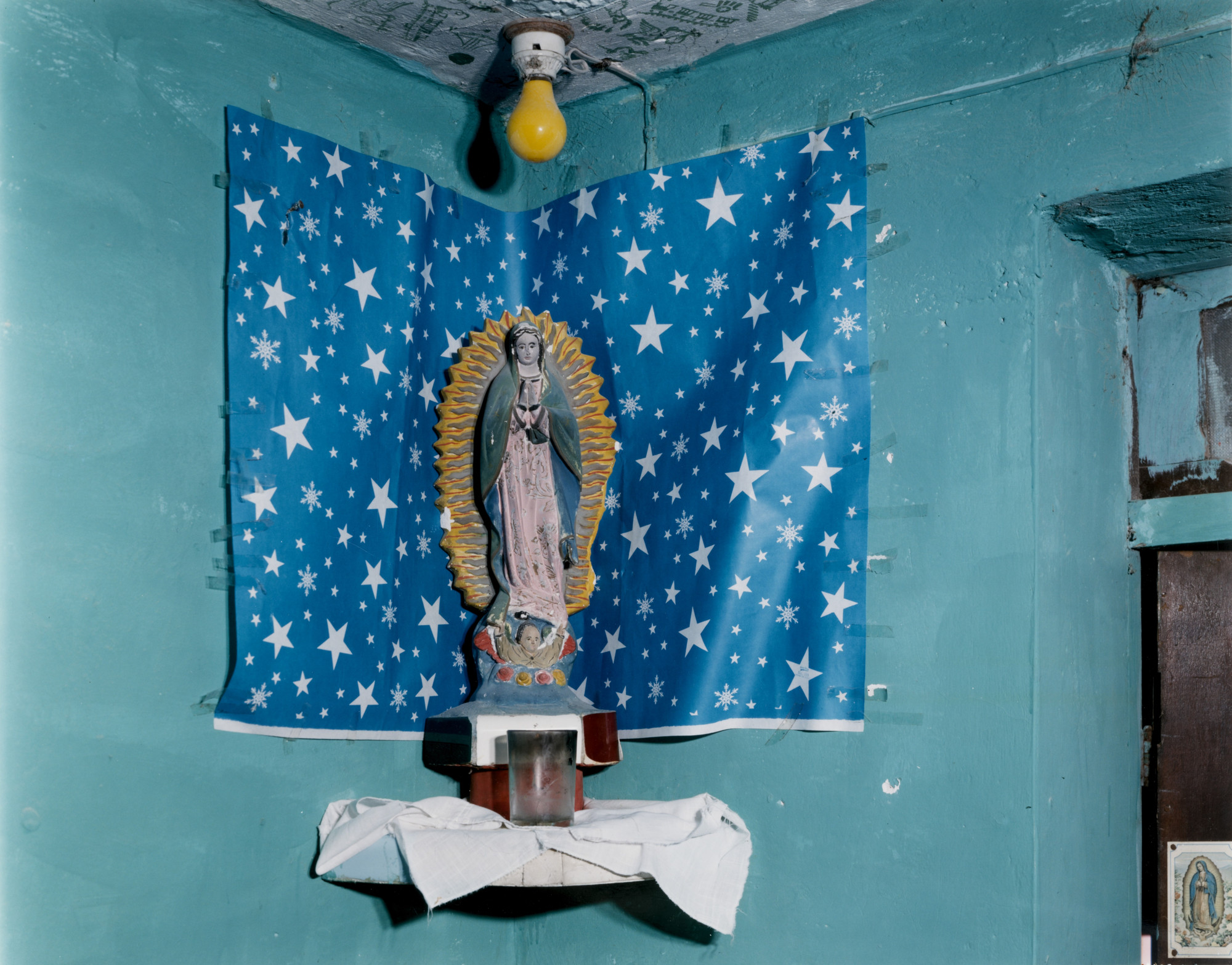 Dana Salvo. Senora de Guadalupe with Star Paper, Mexico, STATUE WITH STAR PAPER AND YELLOW BULB