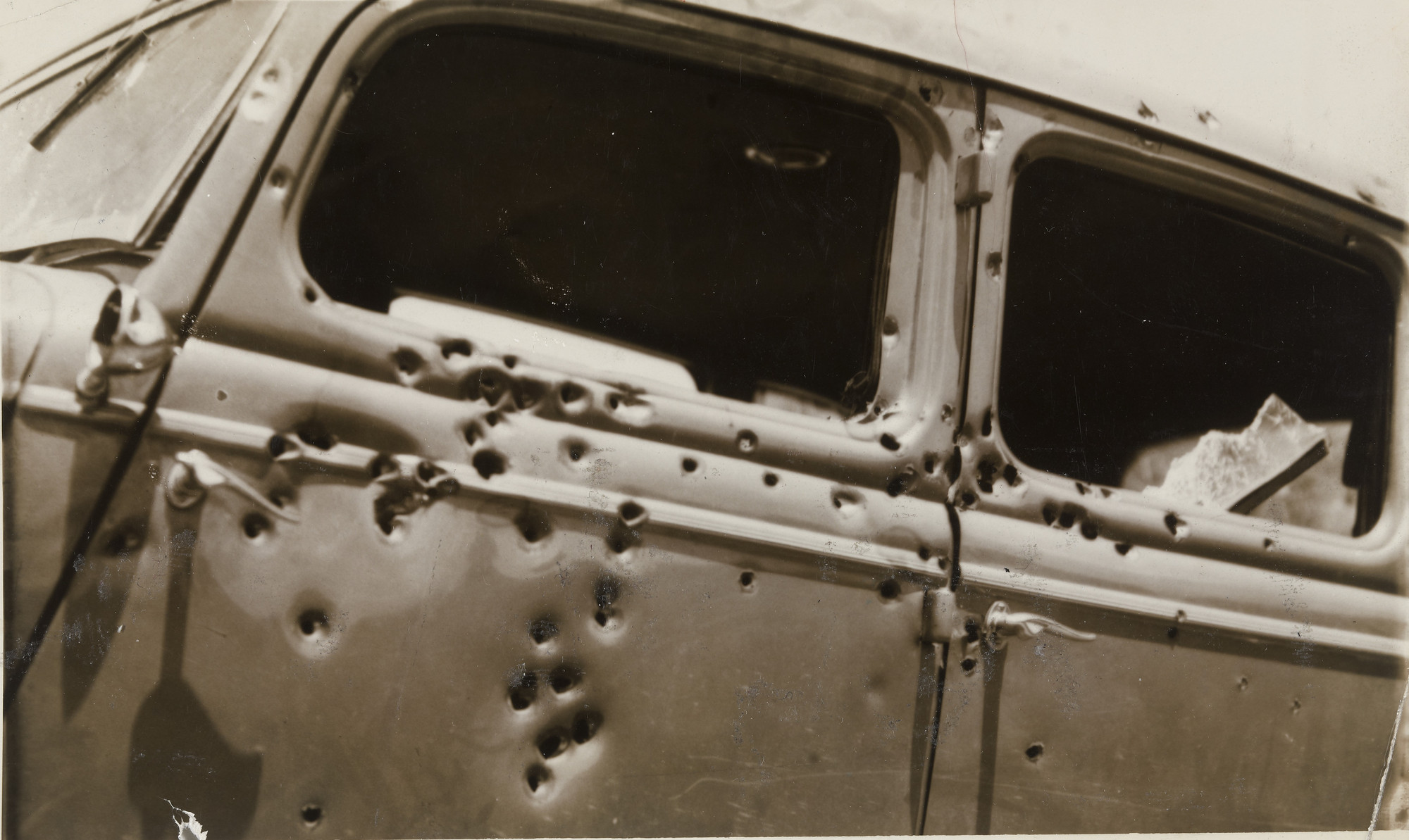 Unidentified photographer. &#34;Car in which Clyde Barrow and Bonnie Parker Were Riddled with Bullets&#34;. 1934