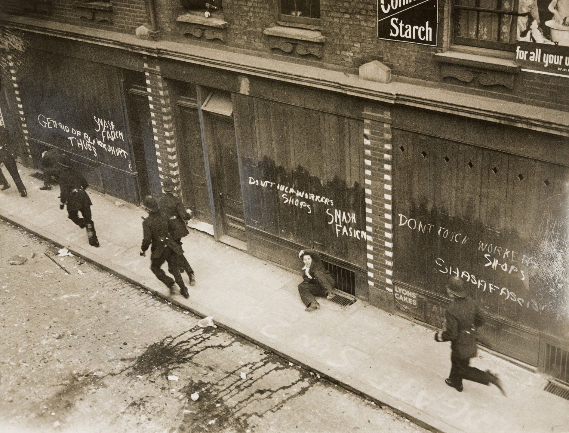 Topical Press Agency. "Fascists and Communists Clash". October 4, 1936