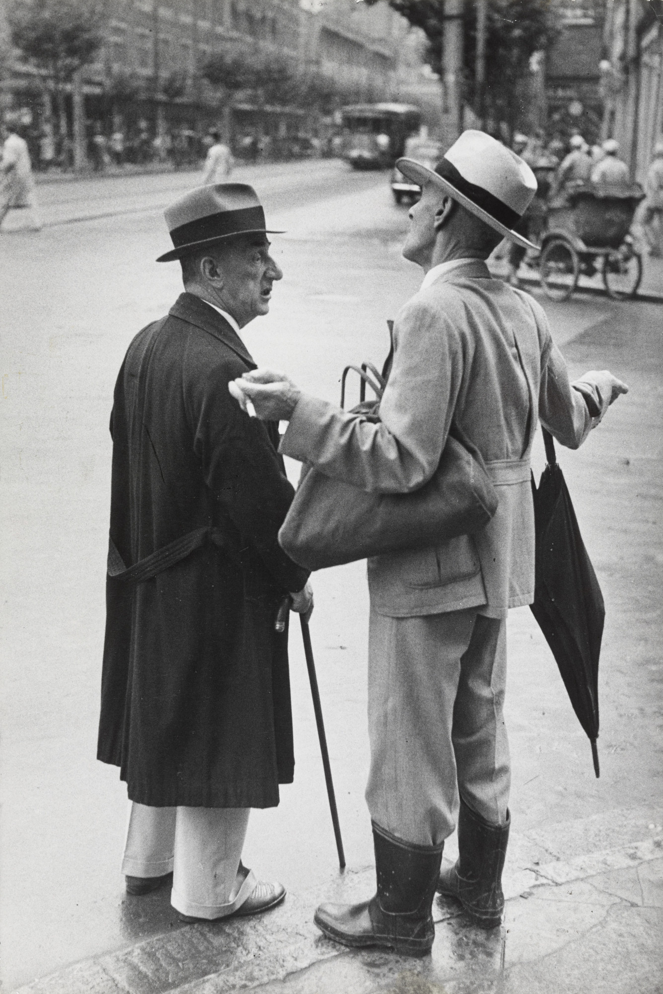 Henri Cartier-Bresson. Two Old China Hands Discuss whether to Leave or Stay after Communist Incursion, Shanghai