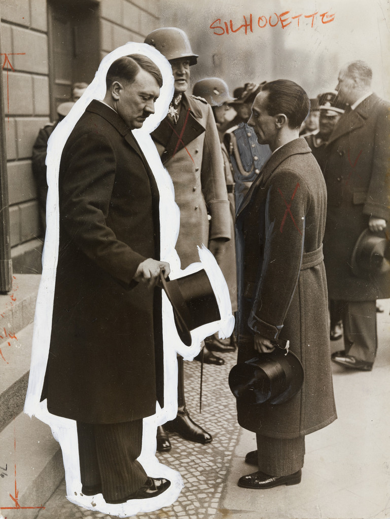 "Chancellor Adolf Hilter Engaged in Earnest Conversation with Dr. Goebbles"