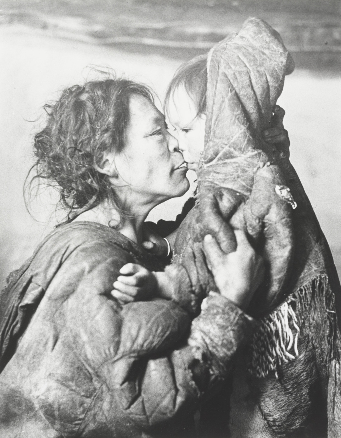 Richard Harrington. Inuit Mother Caresses Her Child in Igloo, Padleimut Tribe, N.W.T.. 1950