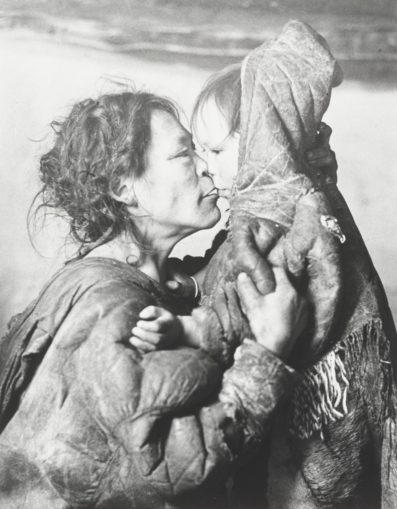 Inuit Mother Caresses Her Child in Igloo, Padleimut Tribe, N.W.T.