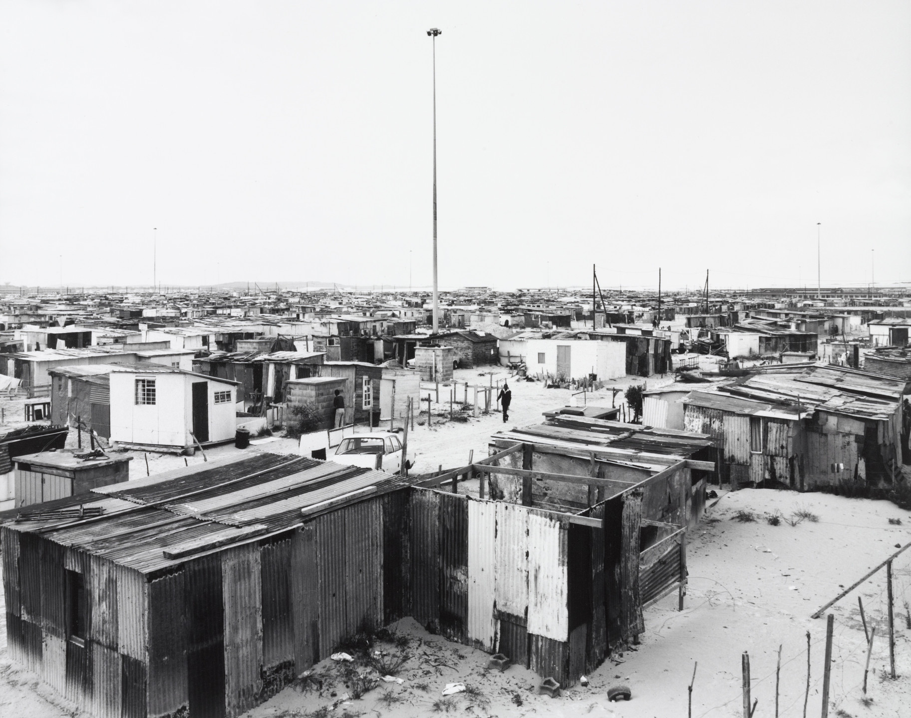 David Goldblatt. Flushing Meadows and Lighting Masts, Site B, Khayelitsha, Cape Town. 11 October 1987