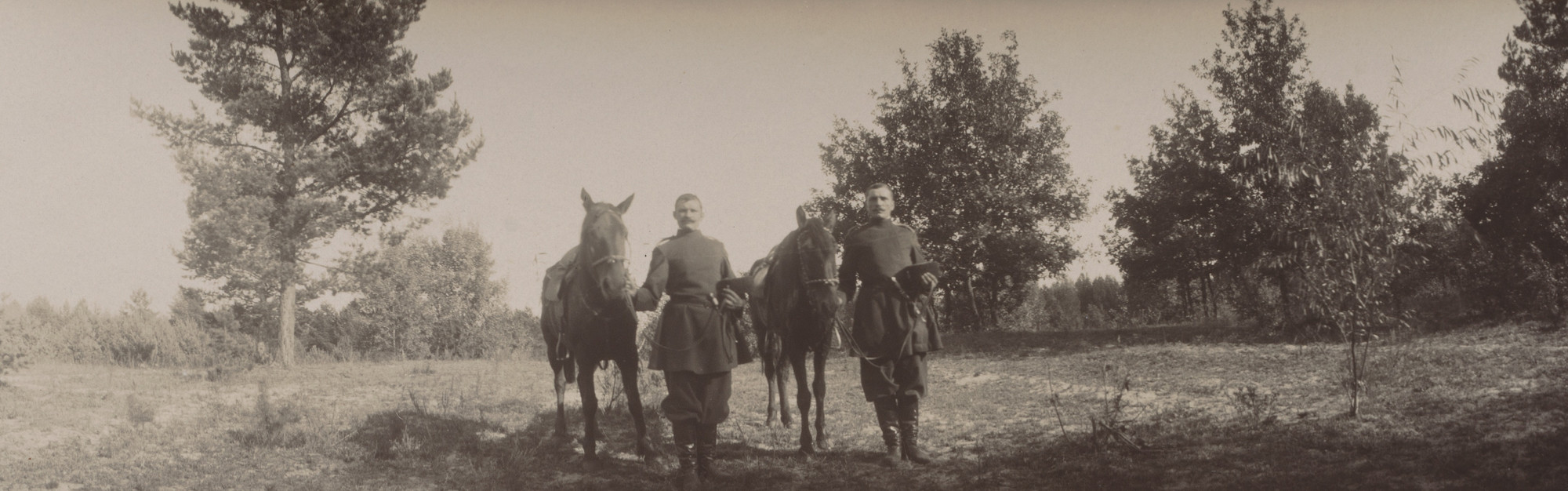 Unidentified photographer. Two Stable Attendants with Hats in Hand Holding Horses, Oldenburg Estate, Ramon