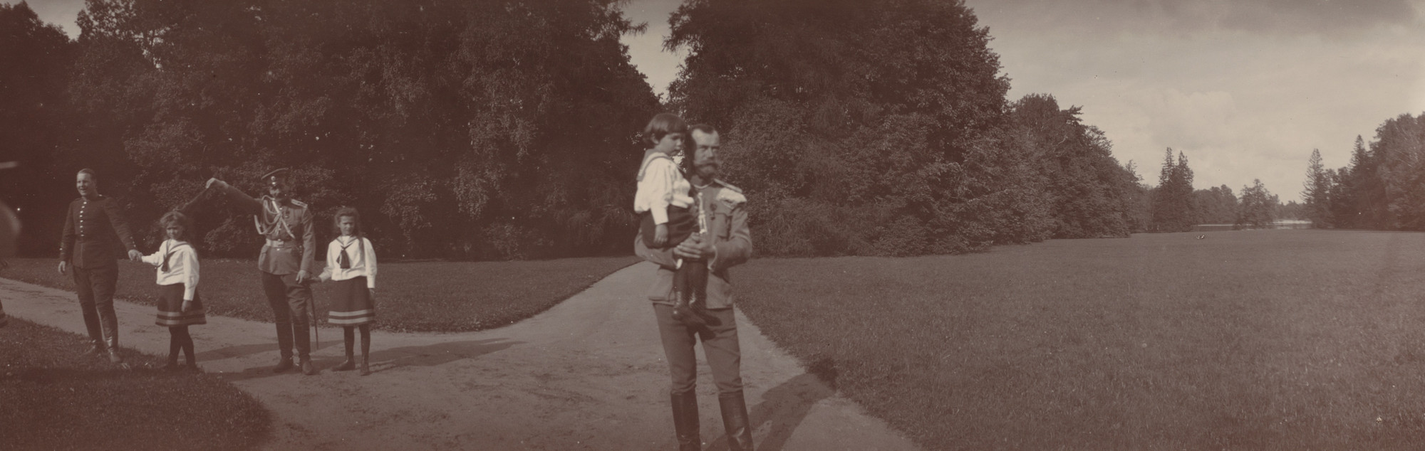 Unidentified photographer. Tsar Nicholas II Holding Tsarevich Alexis, with Grand Duchesses Olga and Tatiana, Ropsha. August 9, 1907