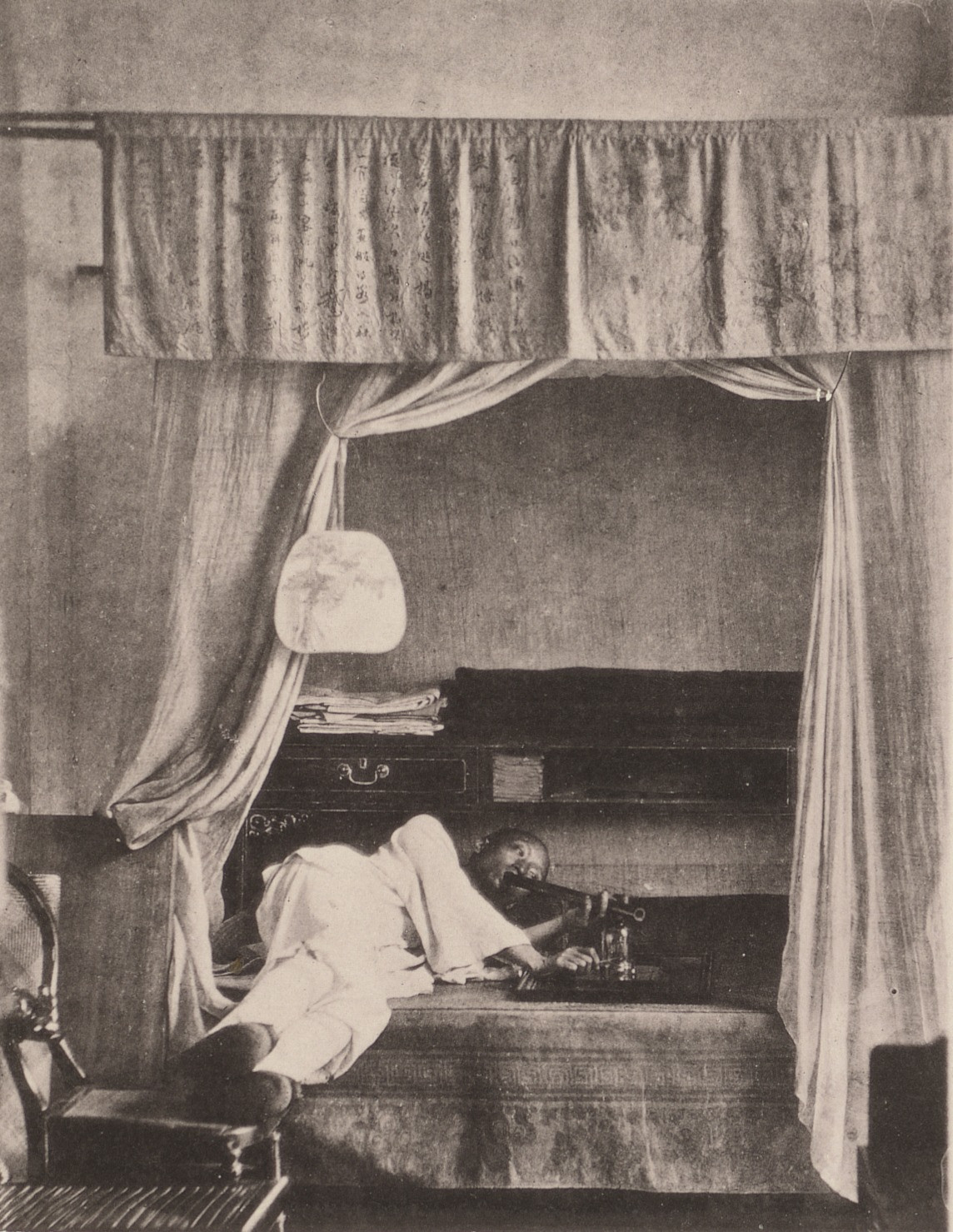 John Thomson. A Whiff of the Opium Pipe at Home