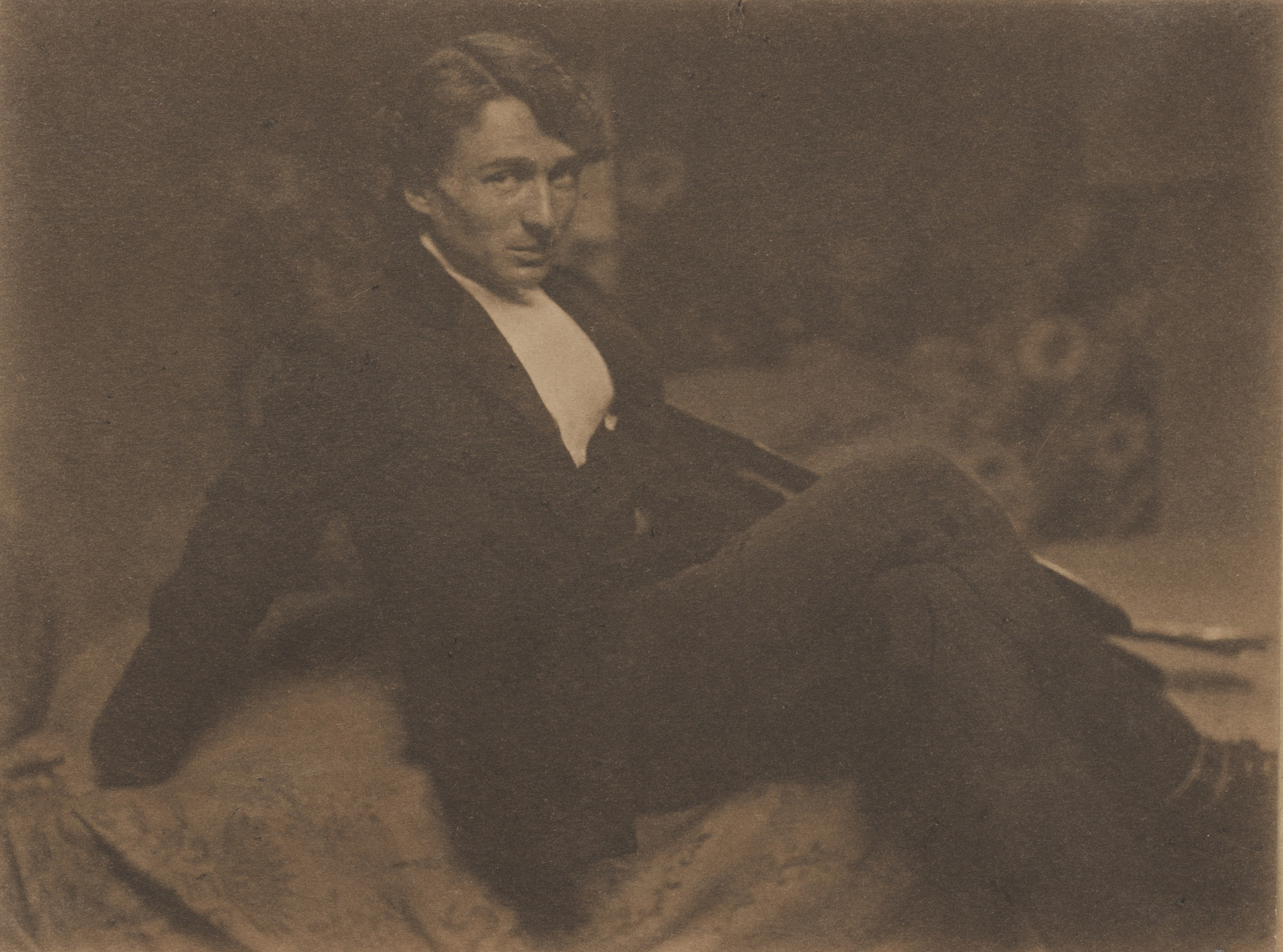 Gertrude Käsebier. (Portrait of Edward Steichen seated on a bed)
