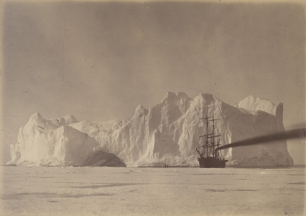 "Between the Iceberg and Field Ice. The "Panther" firing up to escape being forced on to the Berg, as the Ice-Field was swinging towards the Berg which was grounded."
