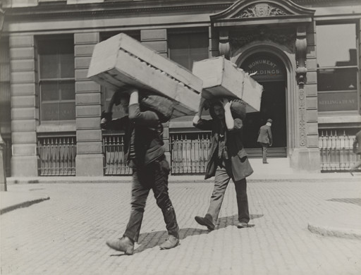 Market Porters Carrying Boxes of Oranges