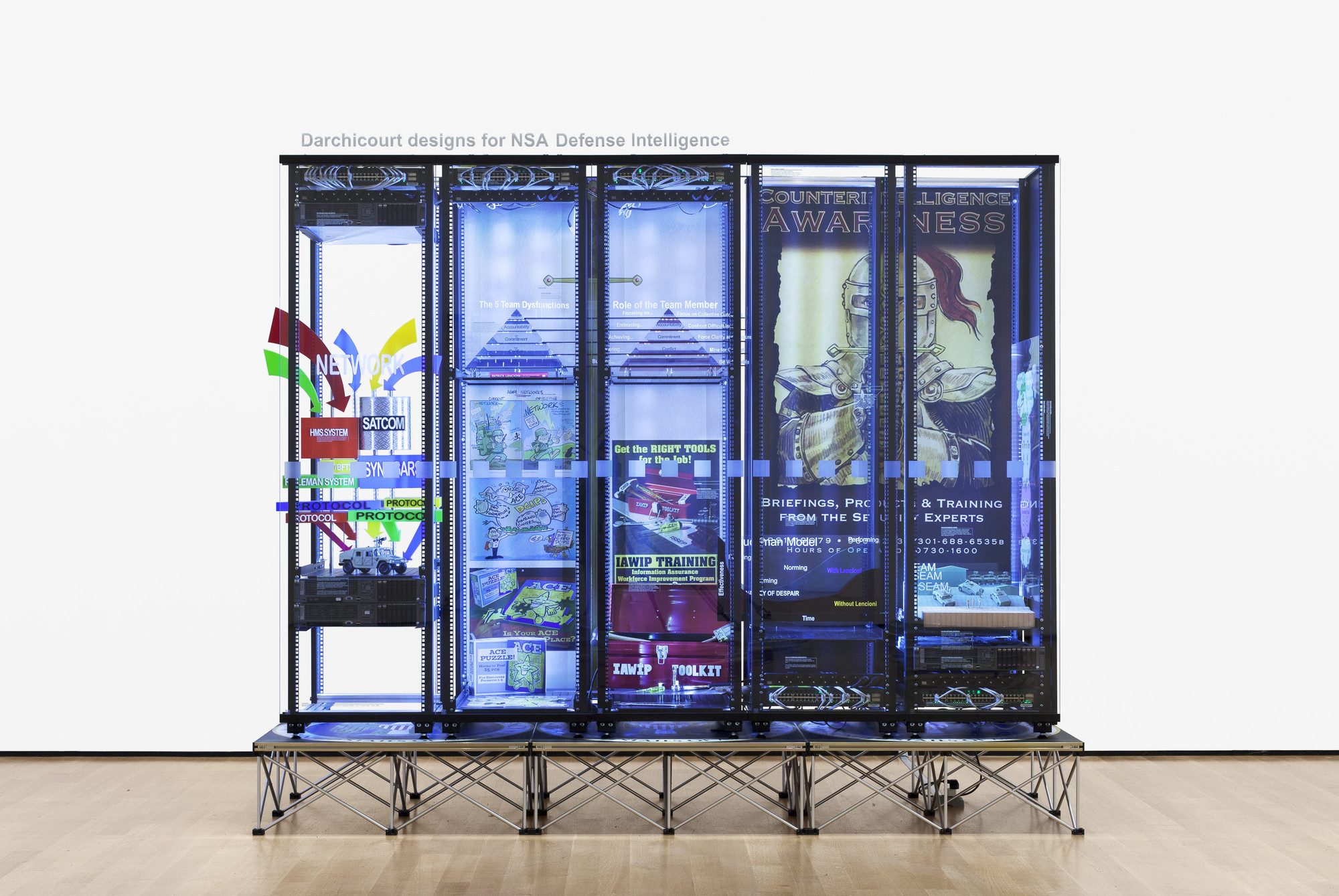 Simon Denny. Modded Server-Rack Display with Some Interpretations of David Darchicourt Designs for NSA Defense Intelligence. 2015