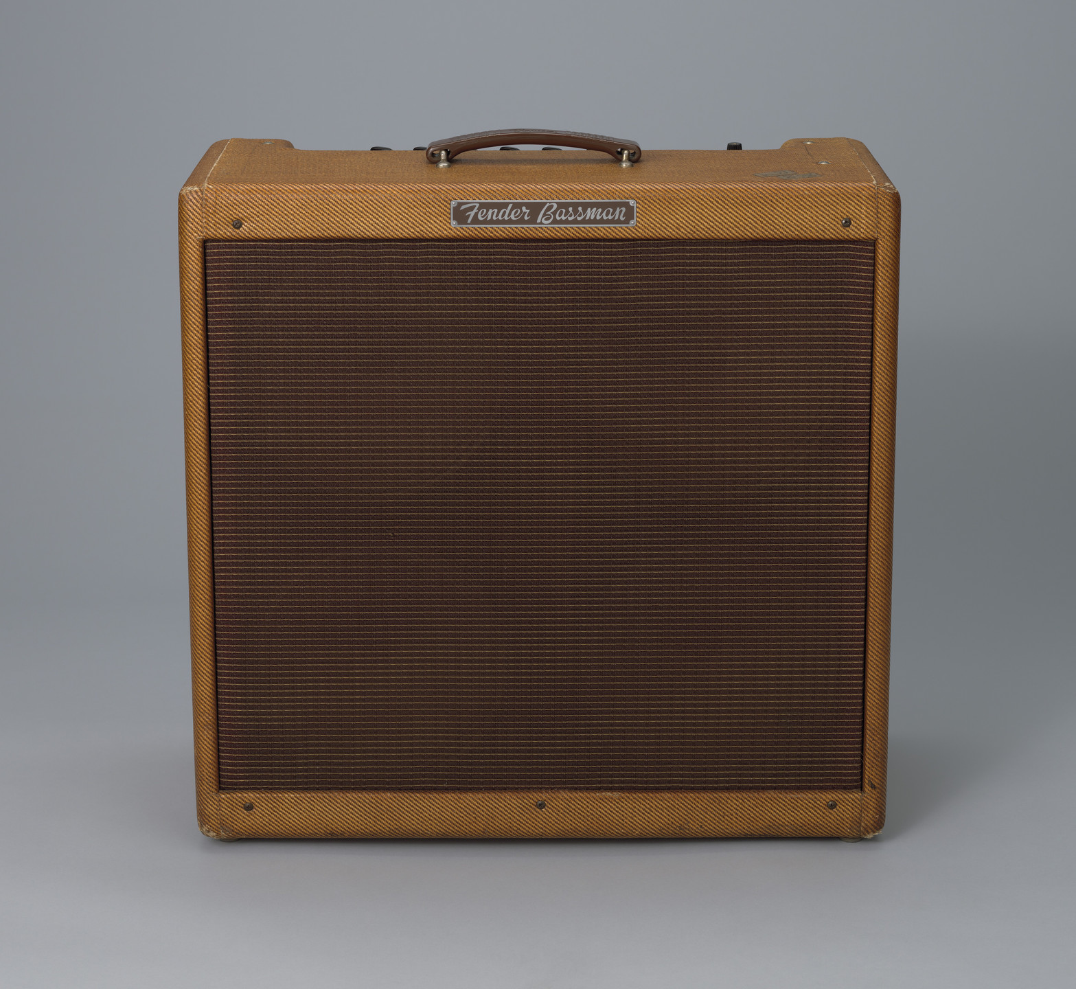 Leo Fender, George Fullerton, Freddie Tavares. Fender Bassman speaker. 1959