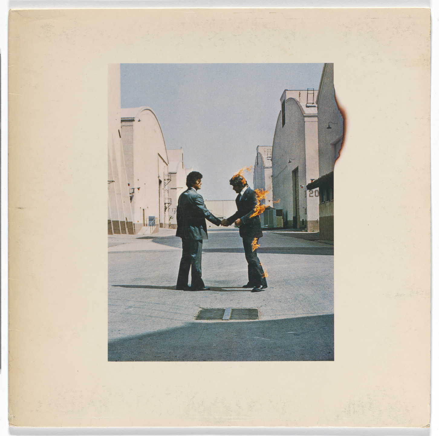 Hipgnosis. Album cover for Pink Floyd, Wish You Were Here. 1975