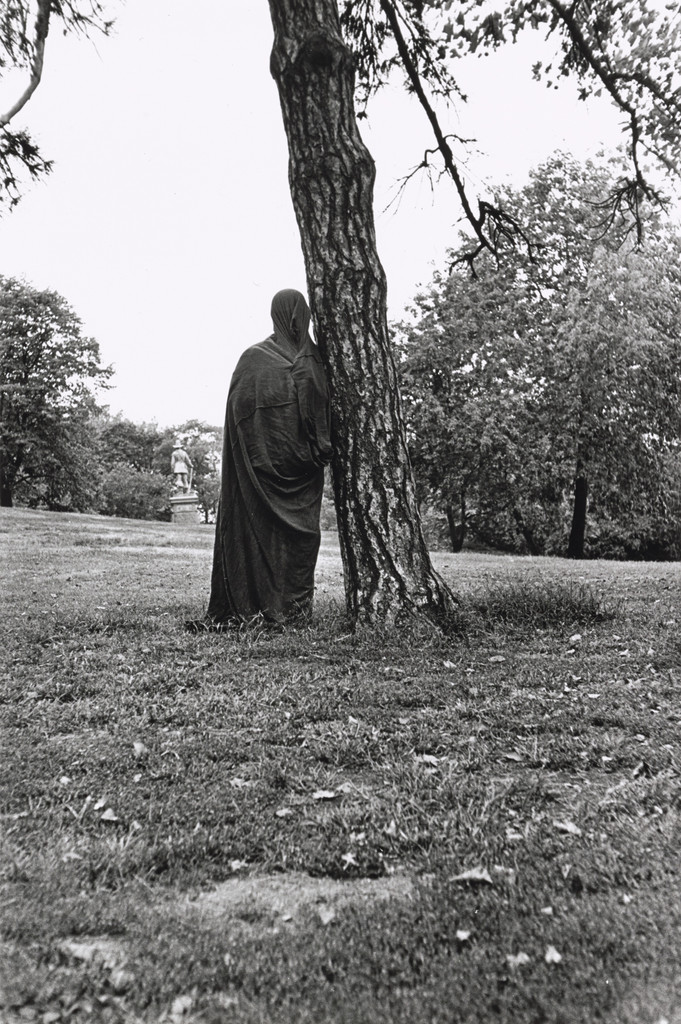 Figure standing in a black bag for Yoko Ono's Cut Piece, 4th Annual Avant-Garde Festival, Central Park, New York, September 9th, 1966