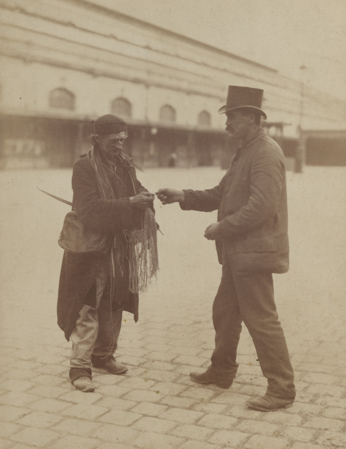 Eugène Atget. Shoelace Vendor. c. 1898