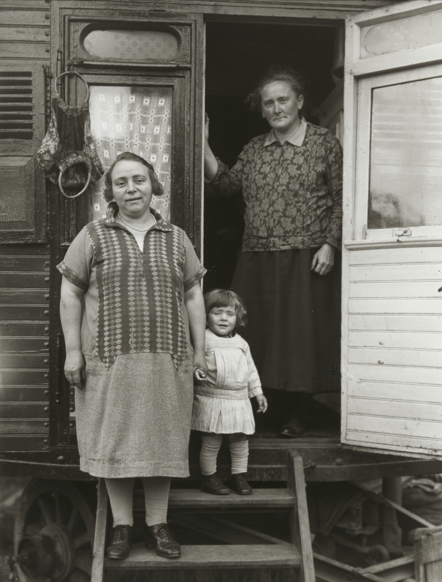 August Sander. Three Generations in Fairground Caravan