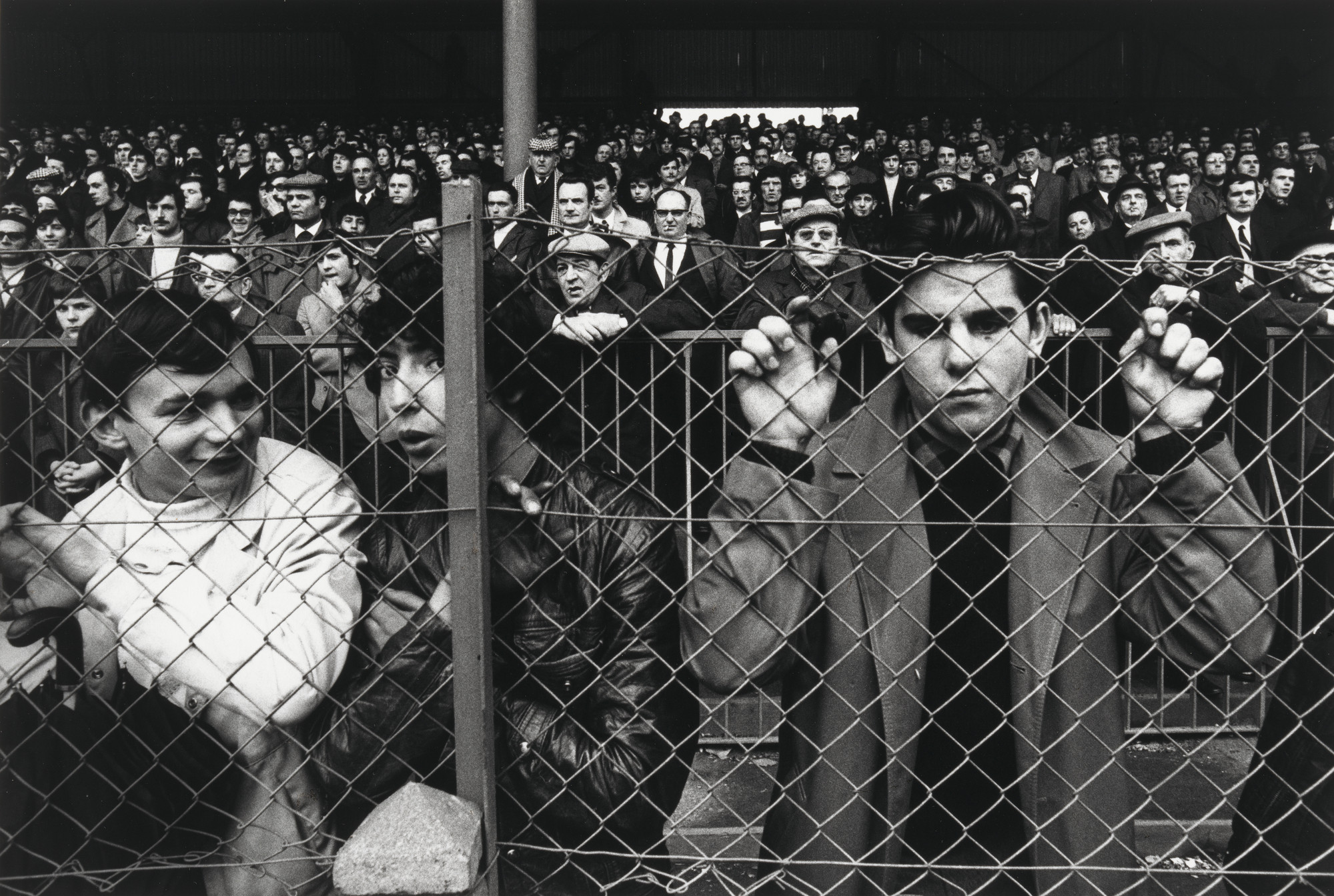 William Klein. Football Crowd through Wire, St. Etienne