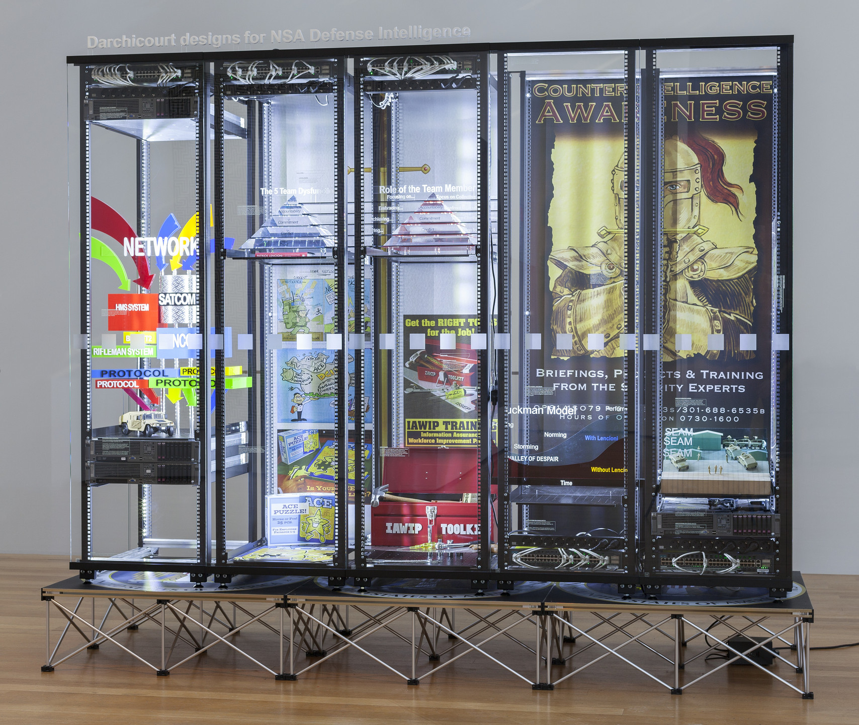 Simon Denny. Modded Server-Rack Display with Some Interpretations of David Darchicourt Designs for NSA Defense Intelligence. 2015