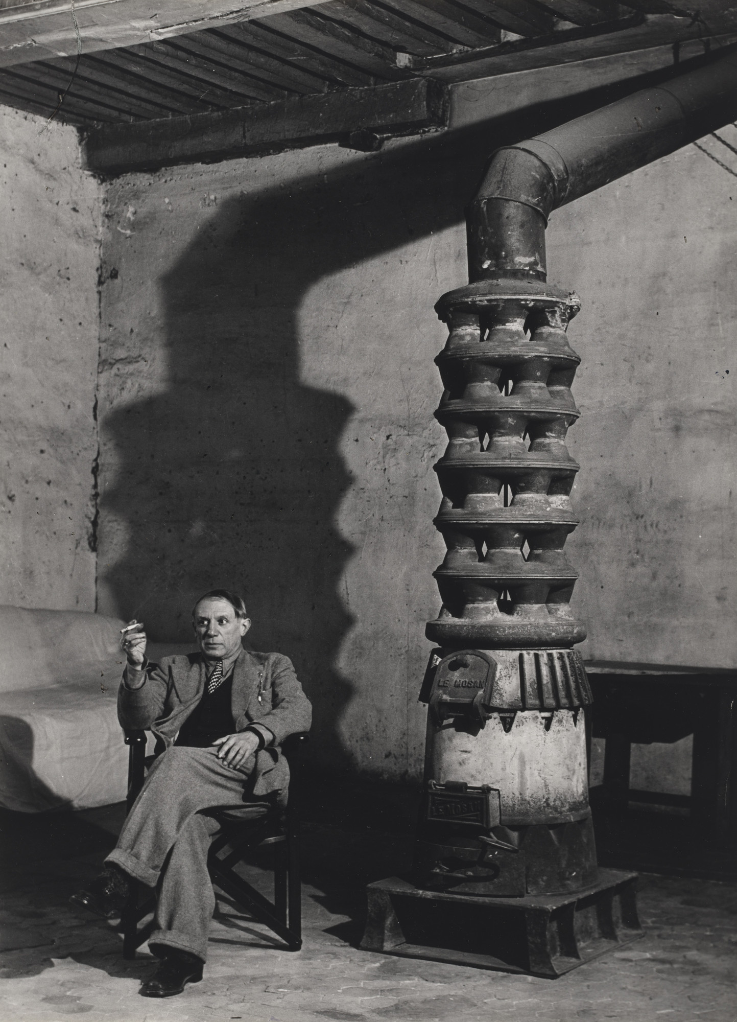 Brassaï (Gyula Halász). Picasso and his Stovem Rue des Grands Augustins, Paris. (Picasso et son poêle)