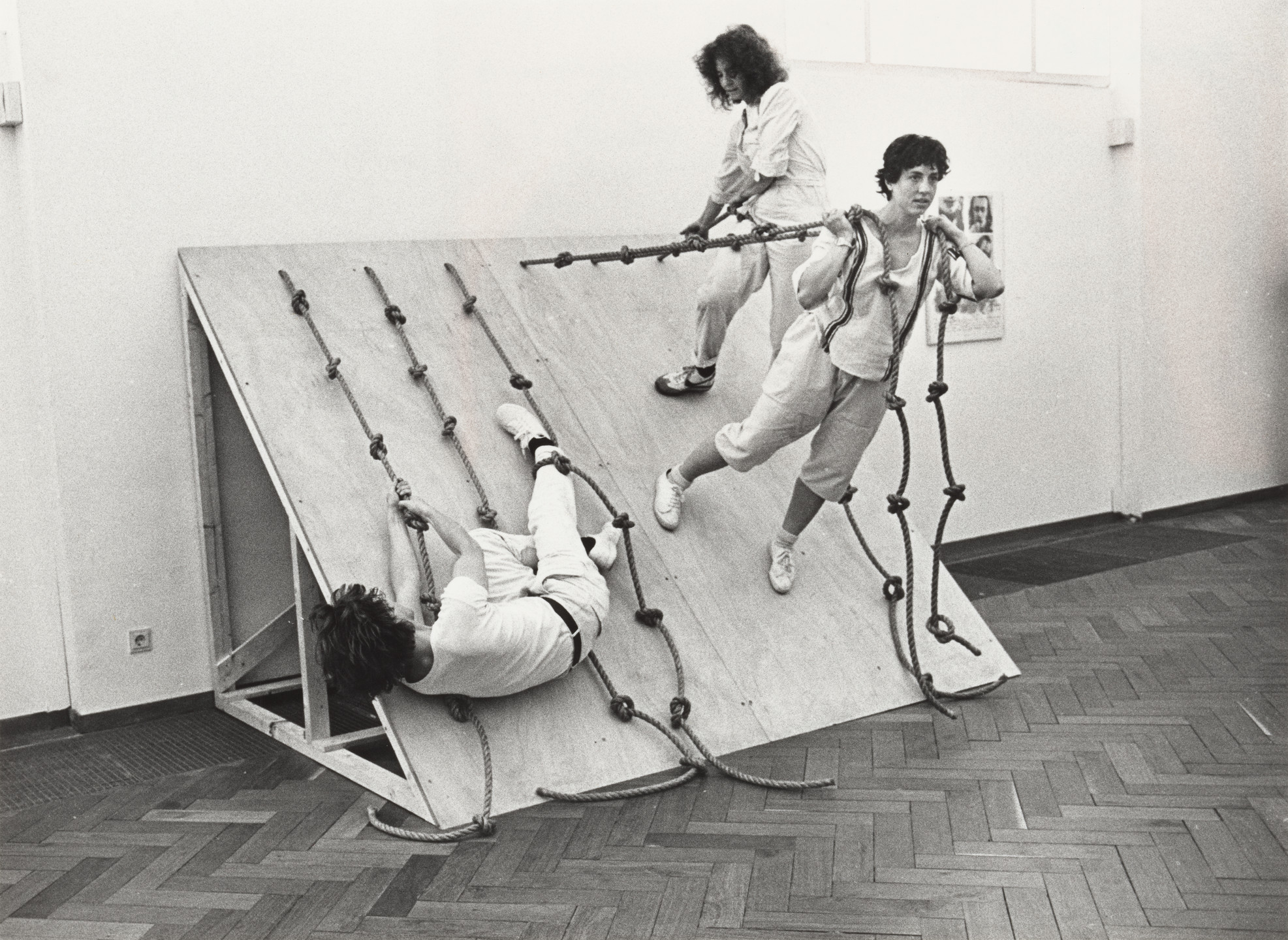 Simone Forti. Photograph of &#34;Slant Board&#34; Performance at the Stedelijk Museum. 1982