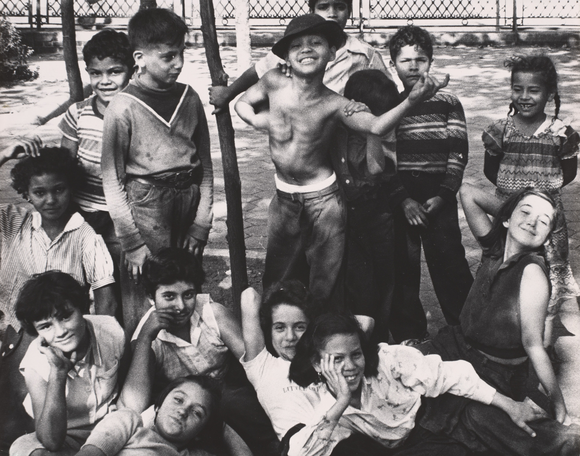 William Klein. Group of Children Showing Off for Camera