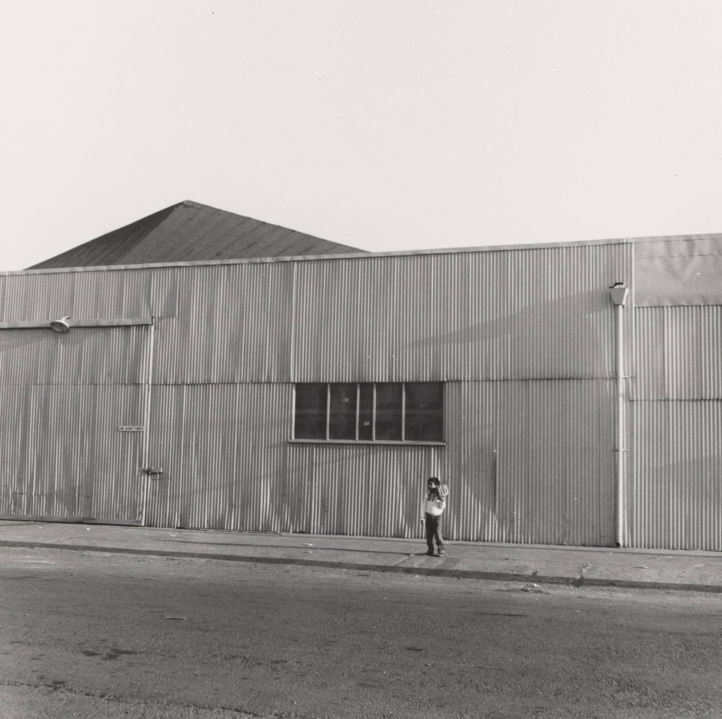 Joanne Leonard. Warehouse and Child with Baseball Mitt, West Oakland, CA. c. 1963-72