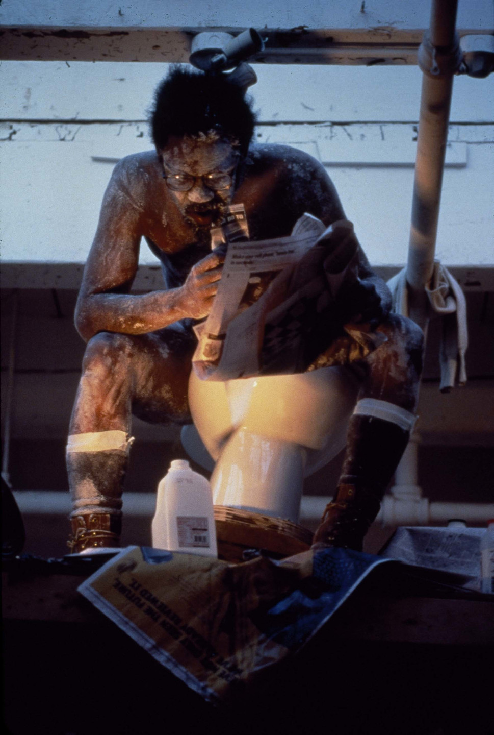 Pope.L. Eating the Wall Street Journal (3rd version). 2000