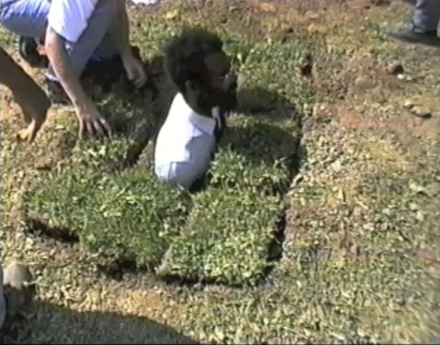 Pope.L. Sweet Desire a.k.a. Burial Piece. 1996
