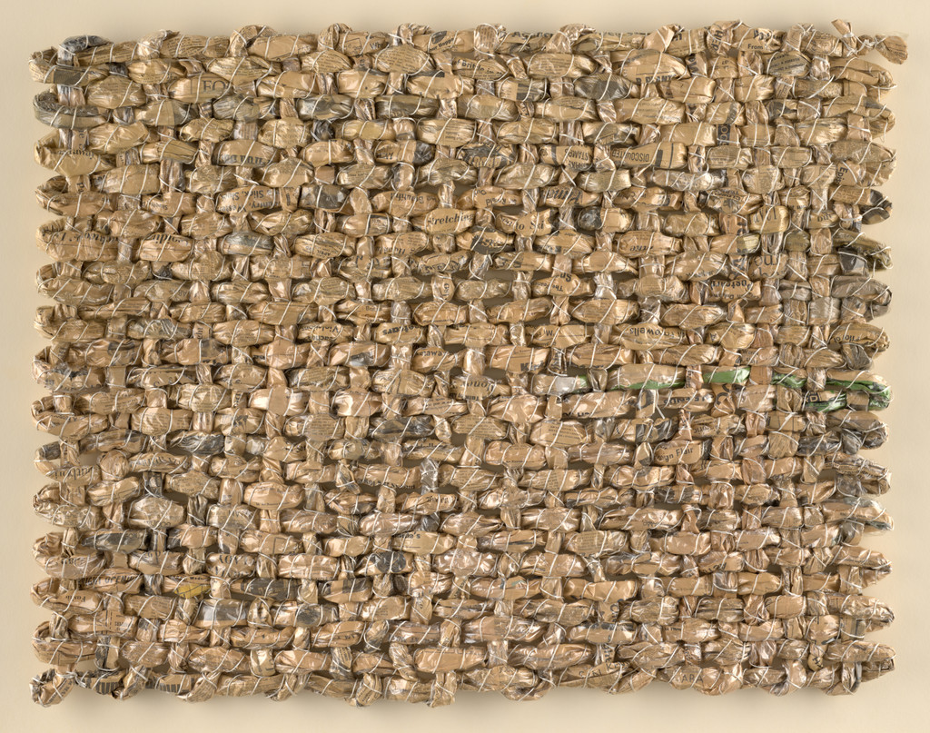 Construction with Newspaper and Plastic Wall Hanging