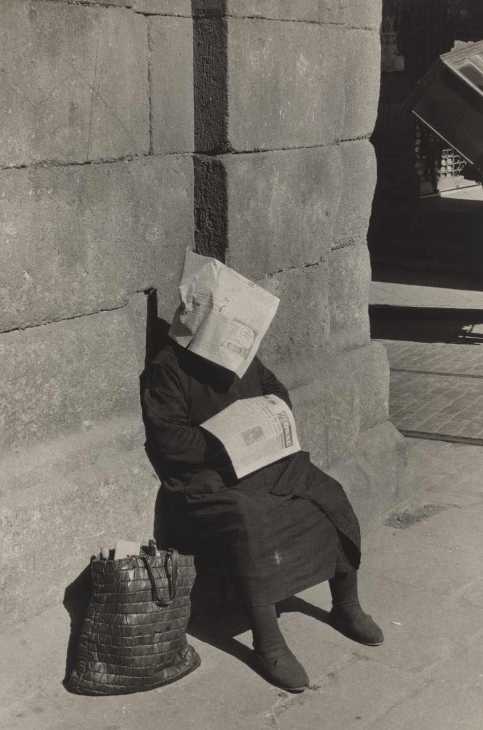 Inge Morath. Siesta of a Lottery Ticket Vendor, Plaza Mayor, Madrid. 1955