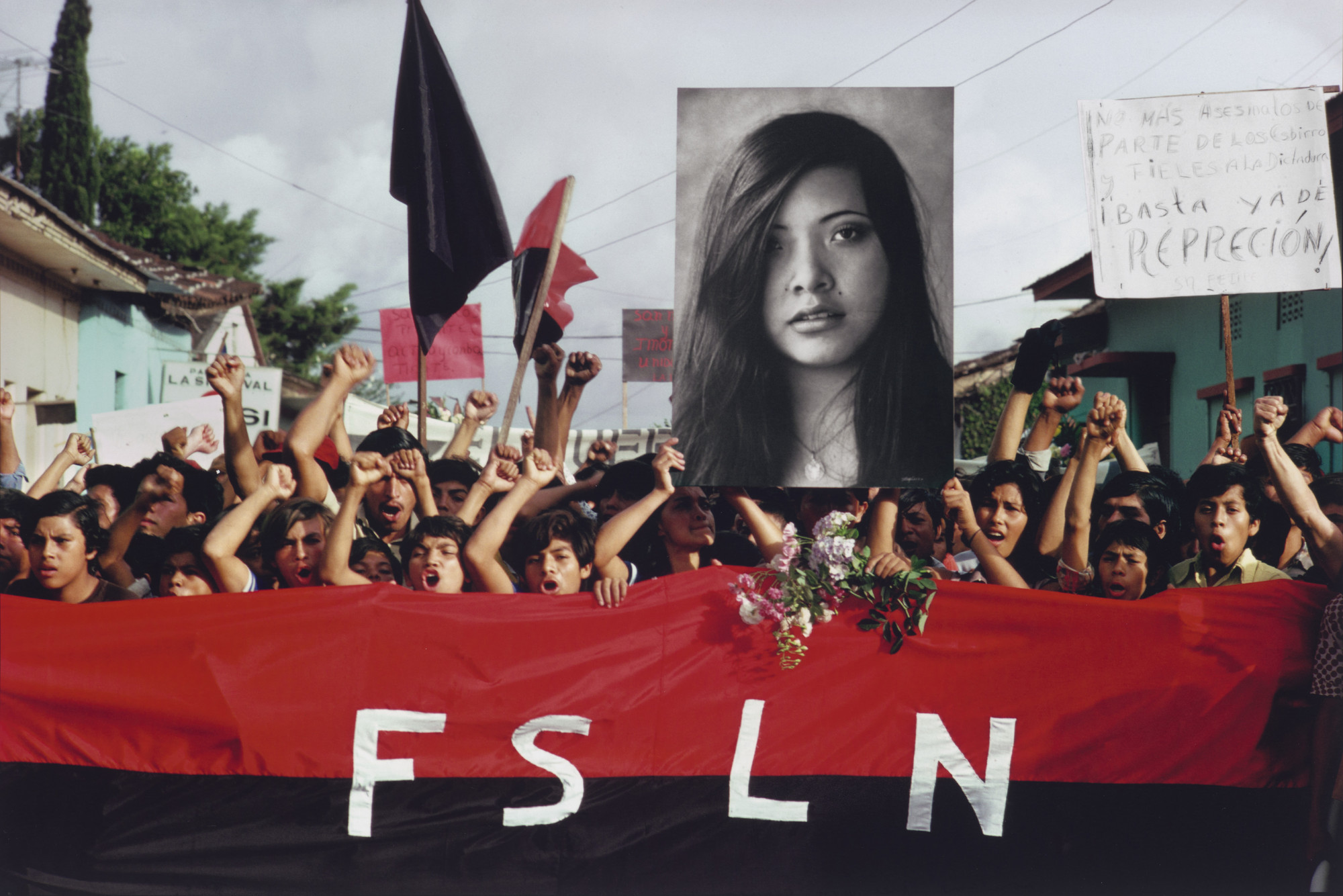 Susan Meiselas. A Funeral Procession in Jinotepe for Assassinated Student Leaders. Demonstrators Carry a Photograph of Arlen Siu, an FSLN Guerilla Fighter Killed in the Mountains Three Years Earlier. 1978