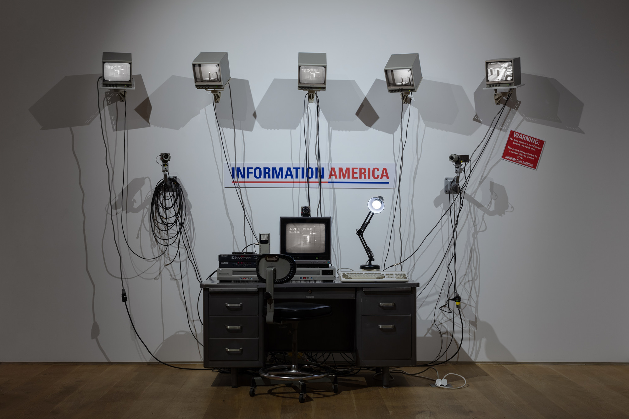 Julia Scher. Information America. 1995