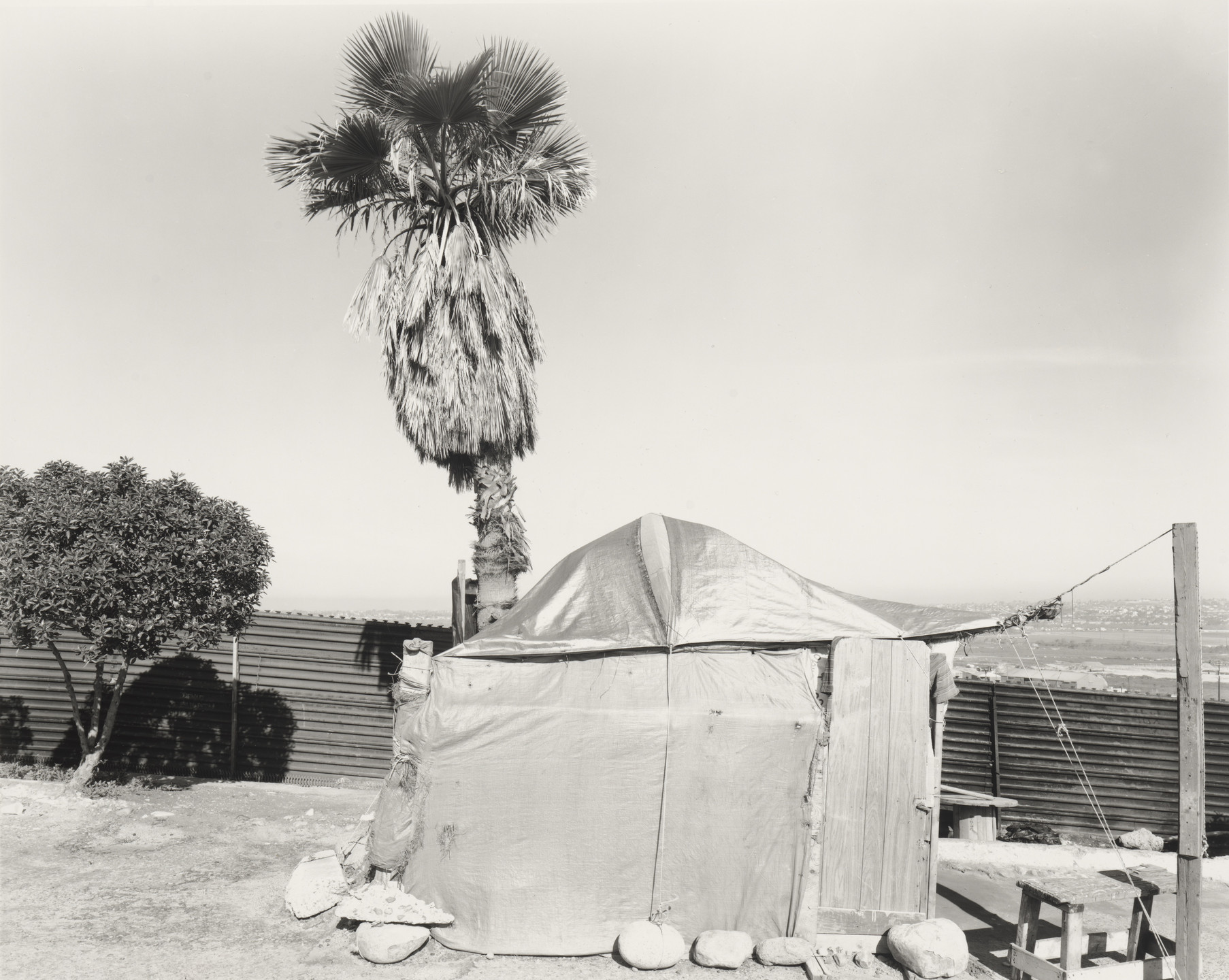 Geoffrey James. Crossing Supplies Tent, Avenida Internacional, Tijuana from the series Running Fence. 1997