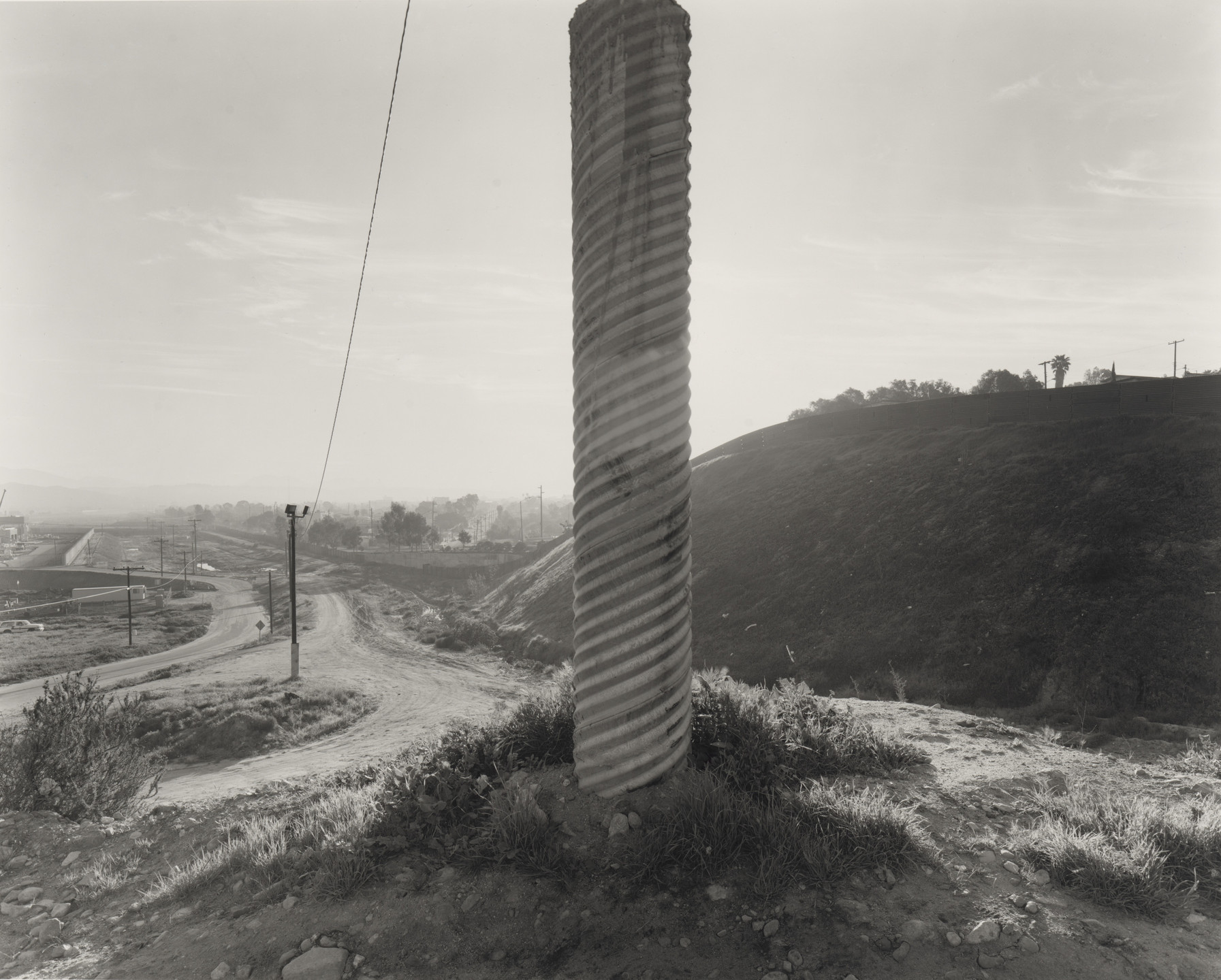 Geoffrey James. East of the Quarry, Looking Toward Tijuana, from the series Running Fence. 1997