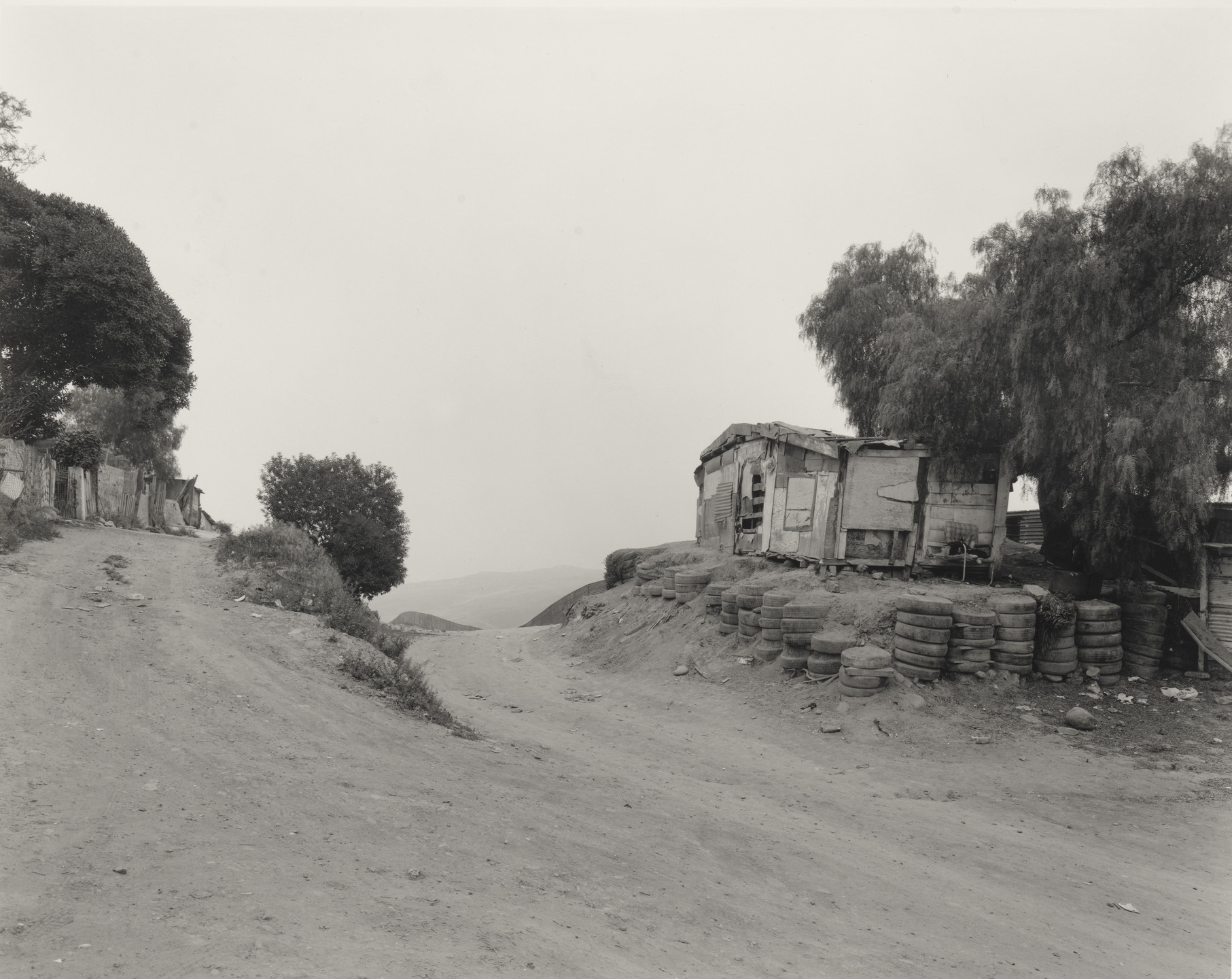 Geoffrey James. House Overlooking the Fence, Colonia Libertad. 1997