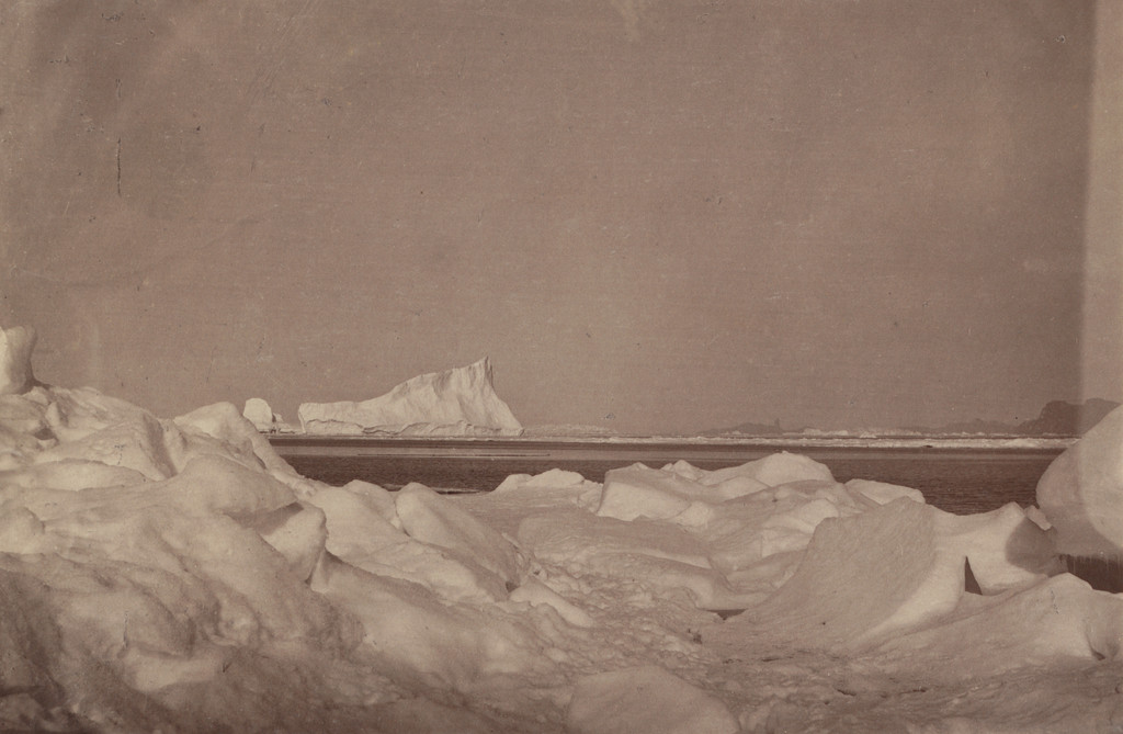 "Wilcox Point and the devil's thumb in the distance, with rafted ice in the Foreground. ",