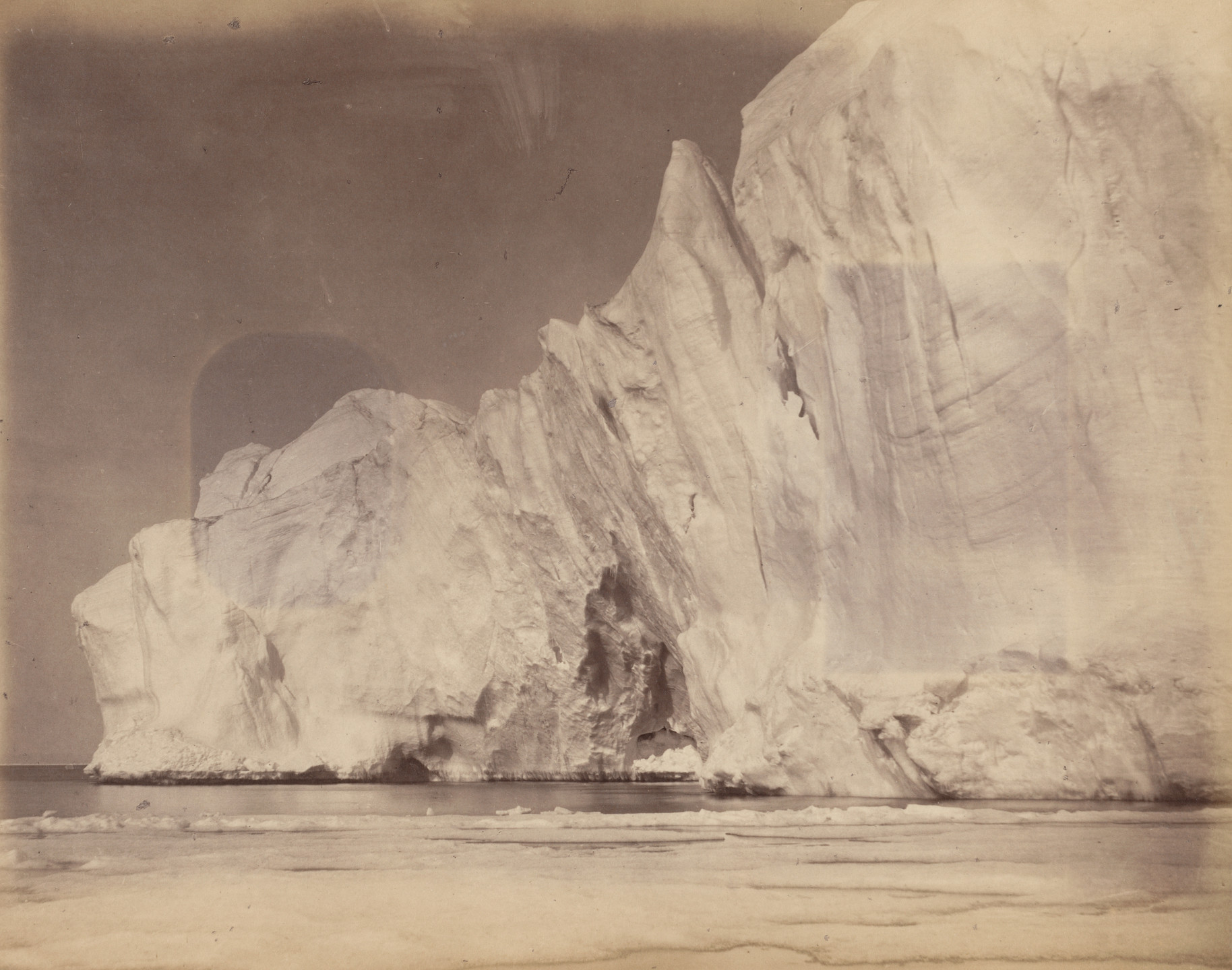 George P. Critcherson, John L. Dunmore, William Bradford. "Section of an immense berg, which was nearly half a mile in length". 1869