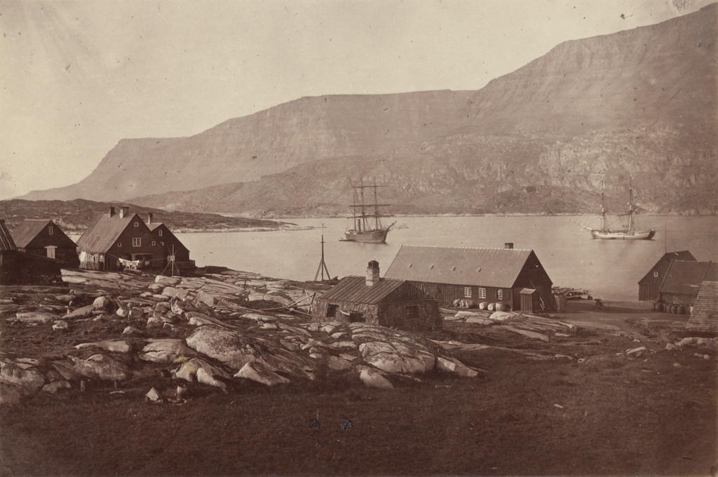 "View of settlement and harbour of Godhavn, on the Island of Disco, the entrance is at the left, between the low rocks and the cliffs."