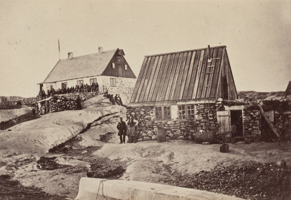 "Motzfeldt's House, in which the ball was given, with a group of Esquimaux in front of it. The house in the foreground is his private residence."