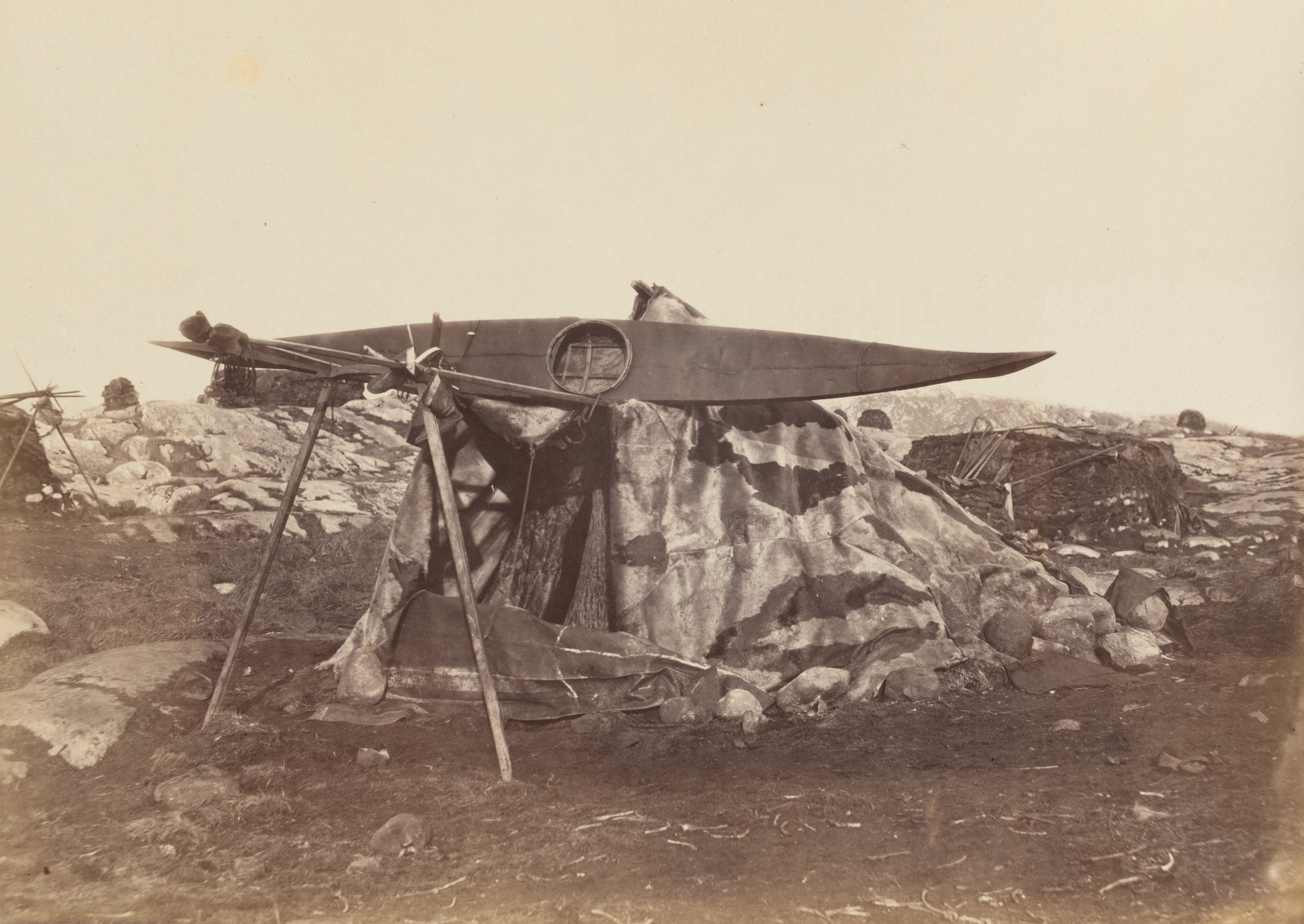 George P. Critcherson, John L. Dunmore, William Bradford. "Esquimaux Toupek or Skin Tent. The boat or kayak is placed on poles to keepit from dogs, which destroy everything they can reach.". 1869