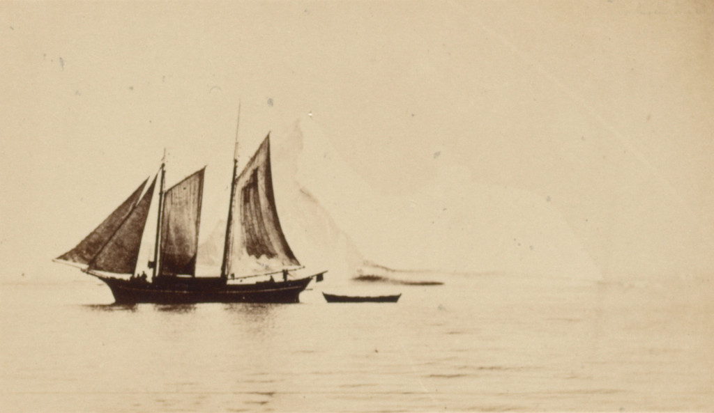 "Sealing vessel passing an iceberg off the coast of Labrador"