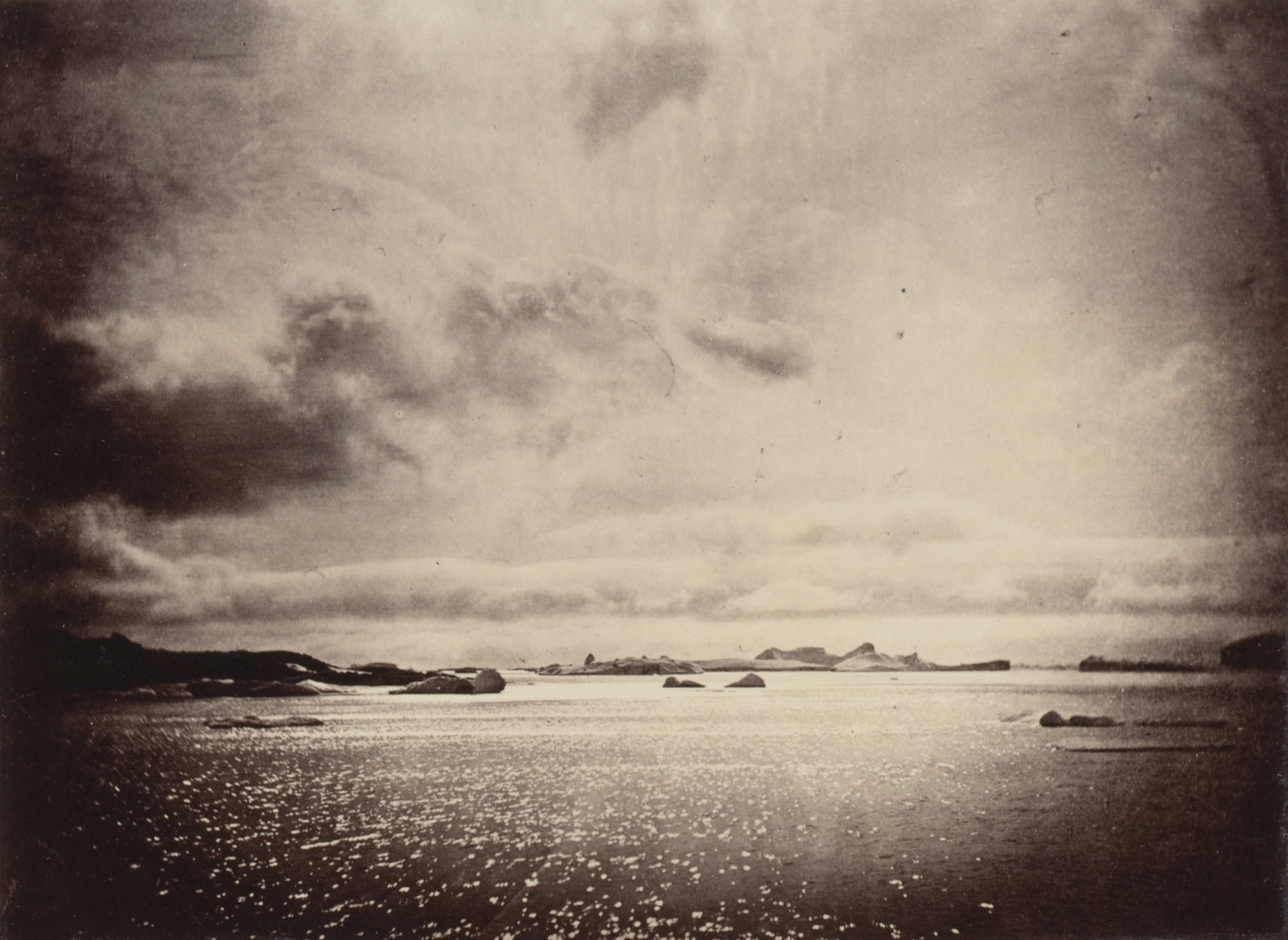 George P. Critcherson, John L. Dunmore, William Bradford. "Instantaneous view of icebergs off the coast, at mid day"