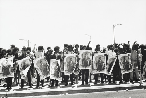 Black Panthers hold Free Huey signs at a rally at the Alameda County Courthouse where Black Panther Minister of Defense, Huey P. Newton, is on trial for killing an Oakland policeman, Oakland, California